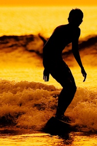 Surfer at Sunset by Azli Jamil